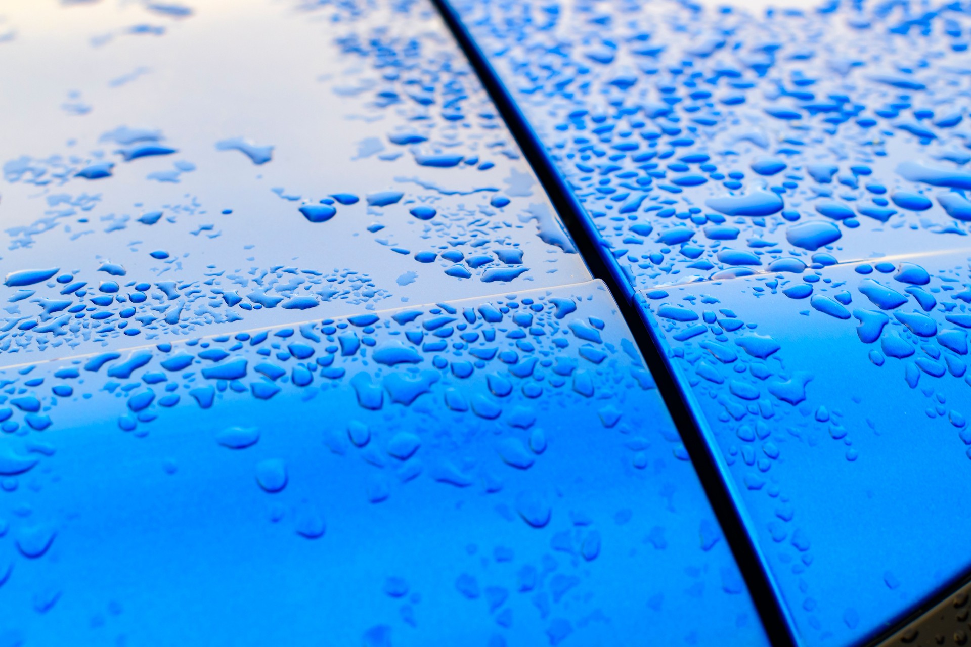 Detail on a modern compact SUV car in bright blue